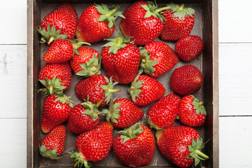Fruit basket, fresh strawberry background.