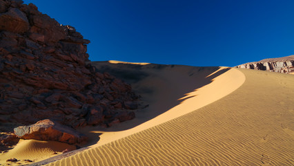 Fototapeta na wymiar Color shadows at dunes in Tassili nAjjer national park, Algeria