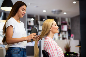 Happy woman at the hair salon