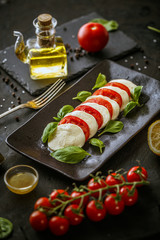Platter with mozzarella cheese and tomatoes