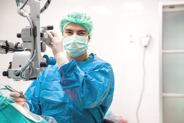 Eye surgeon at work.