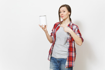 Young beautiful woman in casual clothes pointing index finger on empty paint tin can with copyspace isolated on white background. Instruments, tools for renovation apartment room. Repair home concept.