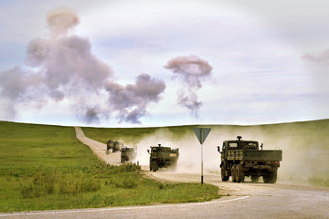 Obraz na płótnie Canvas Hostilities. Military training ground with explosions. Military machines.