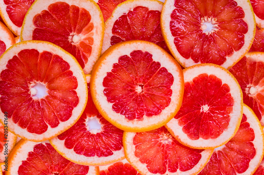 Wall mural Grapefruit slices background