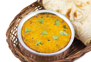 Indian Vegetarian Cuisine Dal Makhani Also Know as Dal Makhni or Daal Makhani is A Popular Dish From Punjab, Cooked With Black Lentil, Red Kidney Beans, Butter And Cream. isolated on White Background