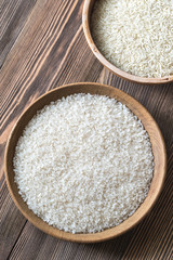 Bowls of uncooked camolino and basmati rice