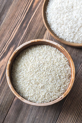 Bowls of uncooked camolino and basmati rice