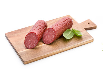 Salami smoked sausage, basil leaves on white background cutout.