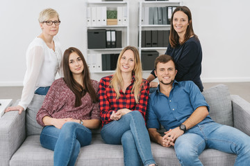 Group of diverse friends relaxing on a sofa