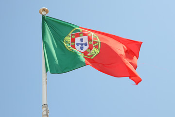 flag of Portugal on a mat in the wind and blue sky