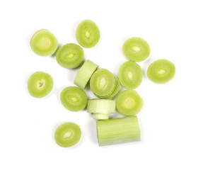 Fresh leeks, pile isolated on white background, top view