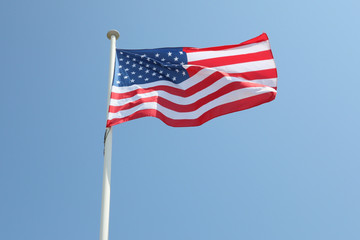 usa flag america on a mat in the wind and blue sky