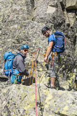 Climbers (mountaineers) on belay stance, preparing for further climbing.