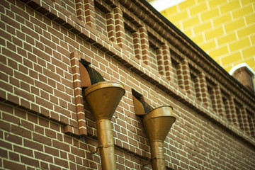 image of vintage Roof gutter pipe line after rain with water drainage.