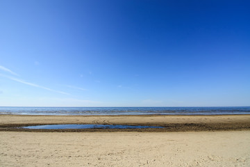 Baltic sea in spring day. Sandy beach in Jurmala, Latvia, East Europe.