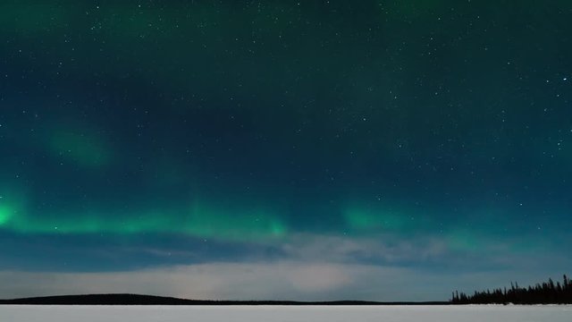 Time lapse of Aurora Borealis (Northern Lights) over lake Pallasjärvi in Pallas-Yllästunturi National Park, Lapland, Finland