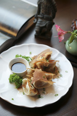 Fried Asian dumplings with soy sauce