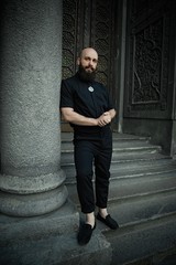 full length portrait of stylish handsome bearded man