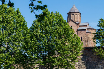 Fototapeta na wymiar Metekhi temple or Church of Dormition of the Virgin Mary in Tbilisi, Georgia