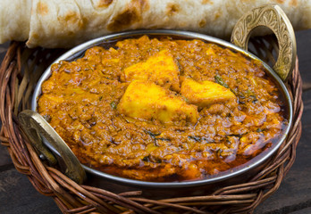 Indian Cuisine Kadai Paneer Served With Tandoori Also Know as Kadhai Paneer or Karahi Paneer is an Indian Dish of Marinated Paneer Cheese Served in a Spiced Gravy on Vintage Wooden Background