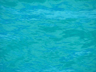 turquoise water, texture; sea surface, background; rhythmic pattern of waves, close-up
