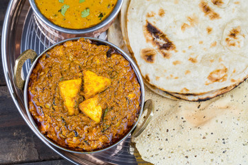 Indian Traditional Thali Food Kadai Paneer Served With Dal Makhani, Tandoori Roti or Papad on...