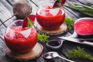 fresh vegetable smoothie from beet with dill on a black wooden table