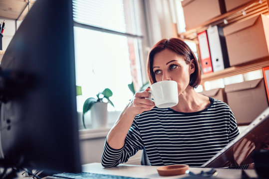 Women drinking coffee at the office