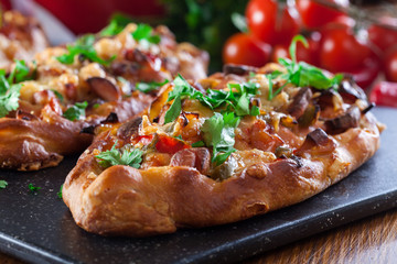 Traditional Turkish pide with meat and vegetables