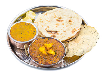 Indian Traditional Thali Food Kadai Paneer Served With Dal Makhani, Tandoori Roti or Papad isolated on White Background