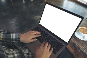 Top view mockup image of businessman using and typing on laptop with blank white desktop screen while sitting on a chair