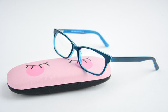 Glasses Rectangular In Blue Frame Are Located On The Case For Glasses