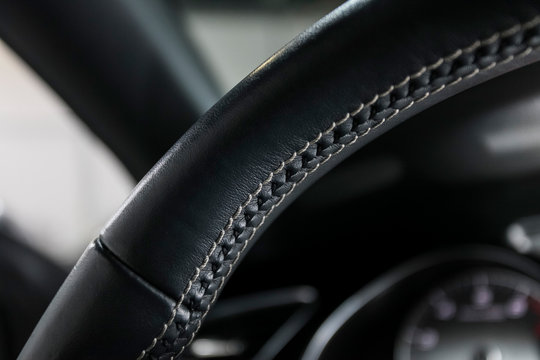 Sport car leather steering wheel with white stiching