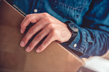 Closeup photo of men holding clip board