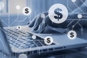 Finance business and e-commerce concept. Dollar digital signs on diagrams and charts on financial infographic. Man using internet on computer on background.