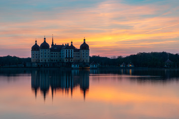Castle Moritzburg in Saxony near Dresden. Pond reflection. Springtime. Germany.