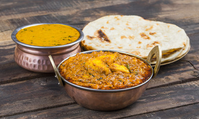 Indian Cuisine Kadai Paneer Served With Dal Makhani or Tandoori Also Know as Kadhai Paneer or Karahi Paneer is an Indian Dish of Marinated Paneer Cheese Served in a Spiced Gravy on Wooden Background