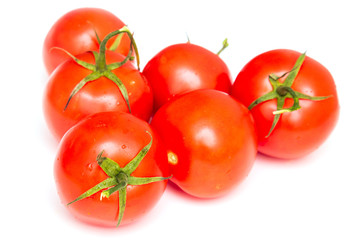 Six red tomatoes on a white background