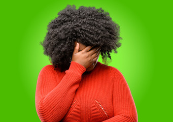 Beautiful african woman stressful keeping hands on head, tired and frustrated