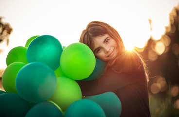 Fototapeta na wymiar Cute girl with air balloons