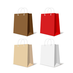 Realistic colorful paper shopping bag set isolated on white background vector illustration.
