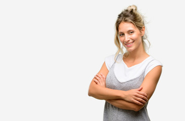 Fototapeta premium Young beautiful woman with crossed arms confident and happy with a big natural smile laughing