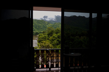 view from the window to the mountains and river
