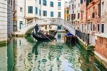 Fototapeta na wymiar Gondola on the picturesque canals of Venice.