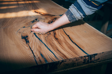 wooden table in solid oak with epoxy resin.