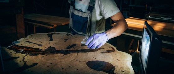  wood processing with epoxy resin and varnish. the manufacture of furniture from solid oak.
