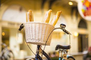 bread in delivery basket on bicycle . selective focus