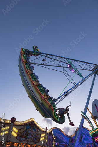 Swing Boat At Fun Fair In The Evening Background Copy