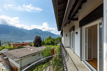 Exterior of villa with large green garden