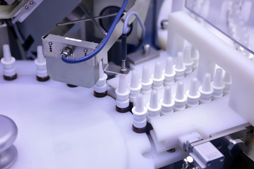 The production line of the medicine. Filling interferon in bottl